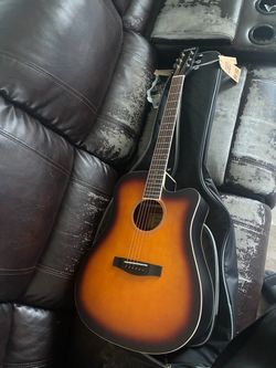 a Donner DAG-1CS 41-inch Cutaway Acoustic Guitar