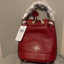 red leather coach hand bag