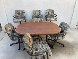 8 Piece Dining Set with Rolling Swivel Chairs and Wood Grain Table