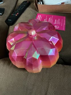 pink-and-orange plastic pumpkin decoration,