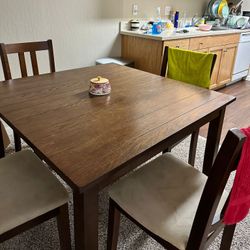 Solid Wood Dining Table And Cushioned Chairs