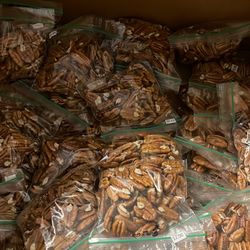 2 Dollar bags of freshly picked  pecans packed with Love .