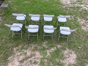 Eight plastic chairs