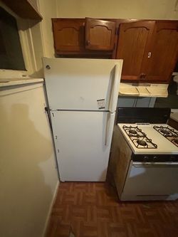 Cheap kitchen fridge, cabinets and table