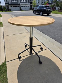 Round Adjustable-Height Table w/ Wheels – Wood Top & Black Base | $100