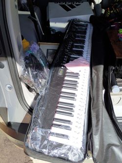 Music keyboard with pedal
