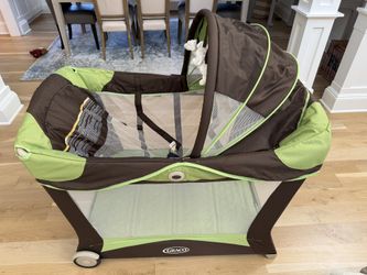 Like-New Graco Pack N Play with Changing Table, Storage Organizer, Full Size Bassinet & Carry Case
