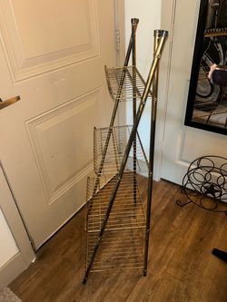 vintage four-tier metal wire display stand featuring an antique gold finish