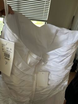 Brand new David’s Bridal wedding dress. Unaltered. Size 12. Tags still attached.