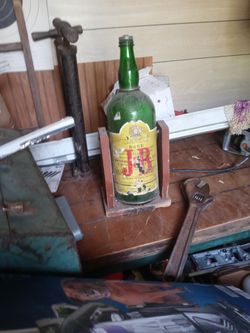 Old Jb Whiskey Bottle On Wood