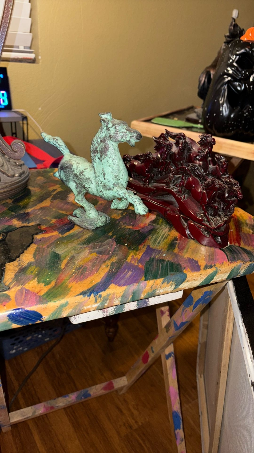 I have two horse miniature miniatures one made out of metal and one made out of wood