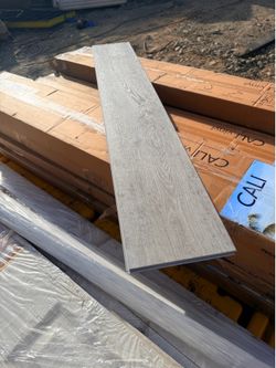 Brand new, factory-sealed CALI Mute Step White Aspen luxury vinyl plank flooring.