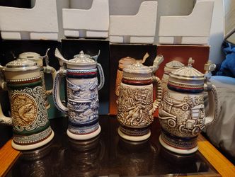 11 beautiful new in box assorted avon beer steins 30$ each or have all of them for 300$.