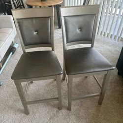 2 comfy gold and brown high top bar chairs