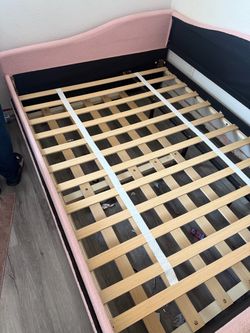 Pink upholstered day bed-full size with twin trundle