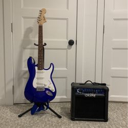 Guitar, Guitar Stand, Guitar Case, and Amp