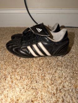 Used Adidas Size 1 1/2 Soccer Cleats. Well worn but still has some life left