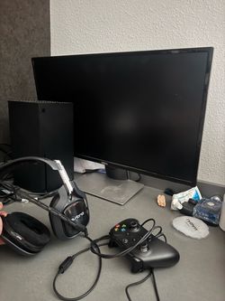 Xbox series X 1TB, two controllers, a40 headset, dell monitor, power cord and hdmi cord