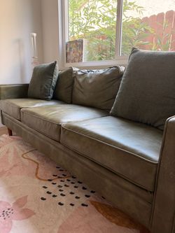 Couch, fairly new but few scratches on the arms
