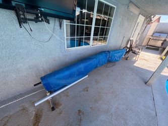 Solar pool cover and reel