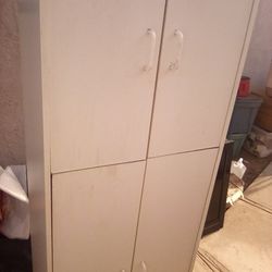 4 Door White Cabinet With Two Shelves Each $15