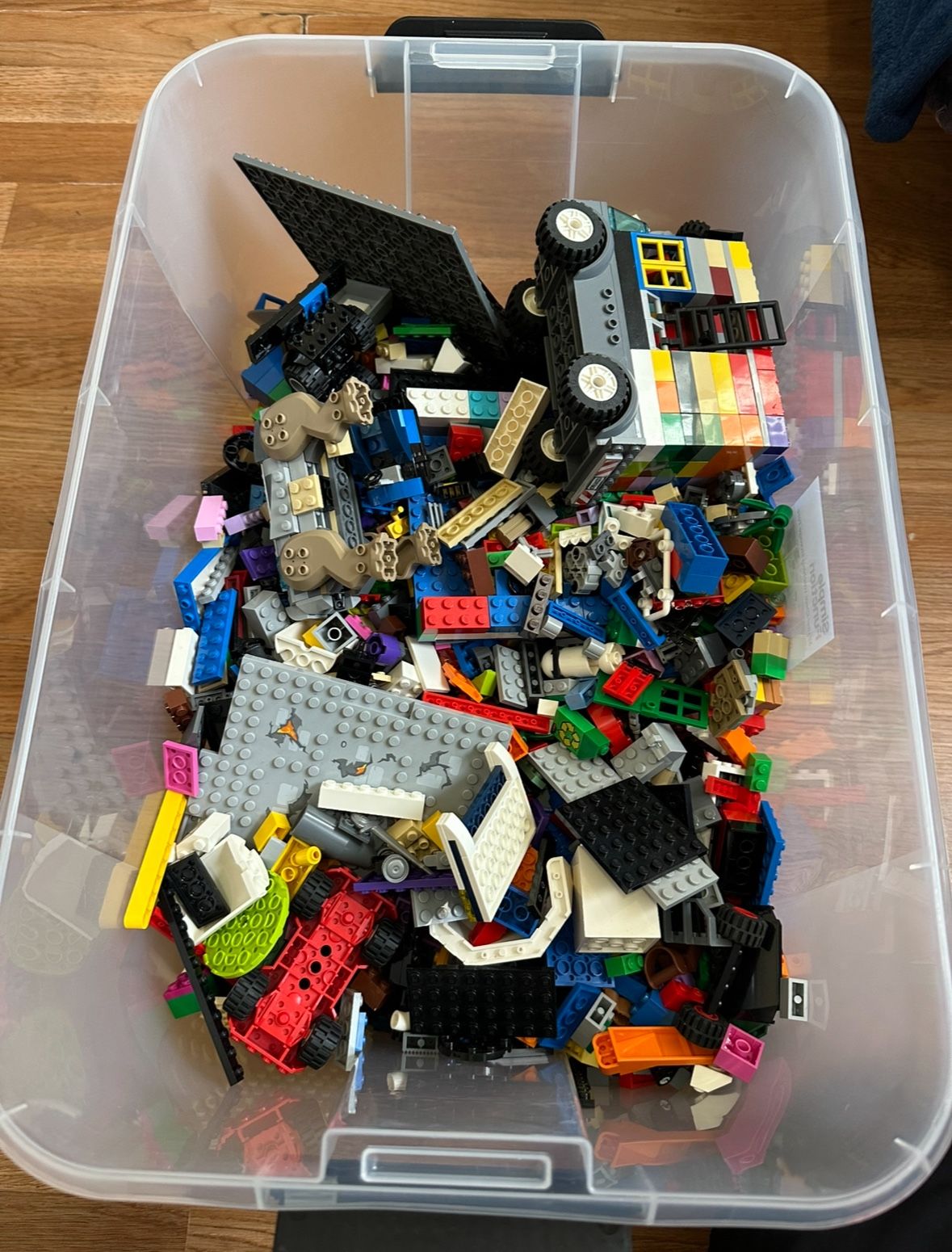 Bin of legos and small legos from star wars, ninjago and more