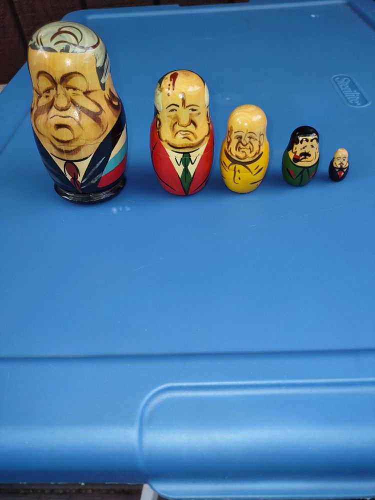 Set of 5 hand-painted Russian wooden nesting dolls featuring former Soviet political leaders.