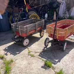 Two radio flyer, wagons, and twin Traxel bike aluminum