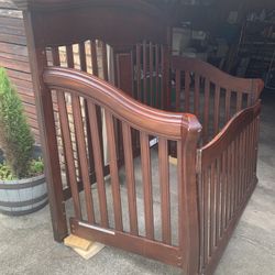 Baby bed with spring and mattress. Turns into toddler bed and full-size headboard
