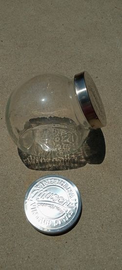 Tilted Mason Glass Jar With An Extra Lid