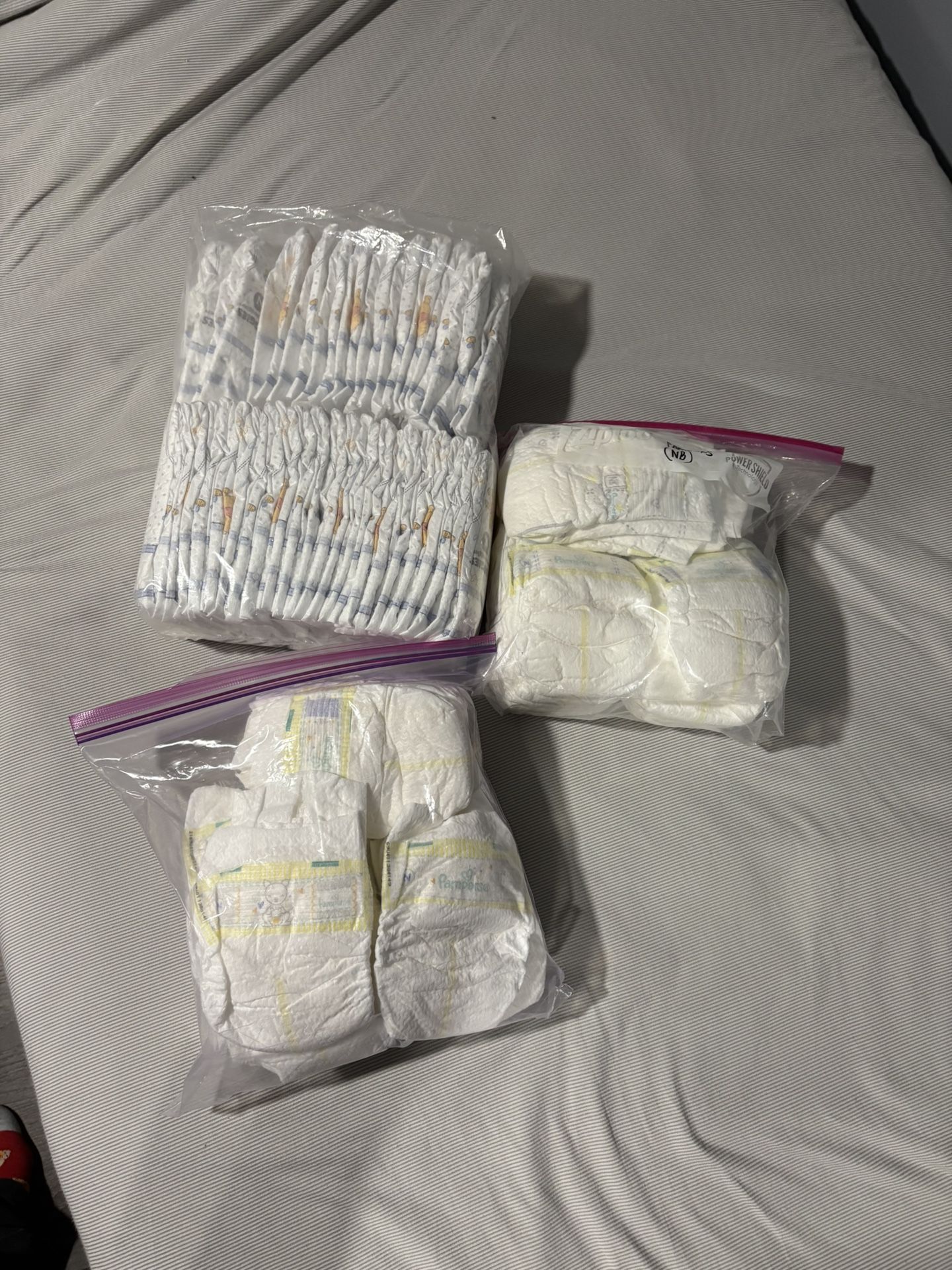 New Born Diapers (71 Diapers) Huggies & Pampers