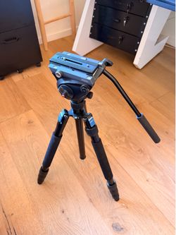 Manfrotto 502AH Video Head mounted on Sirui Tripod Legs
