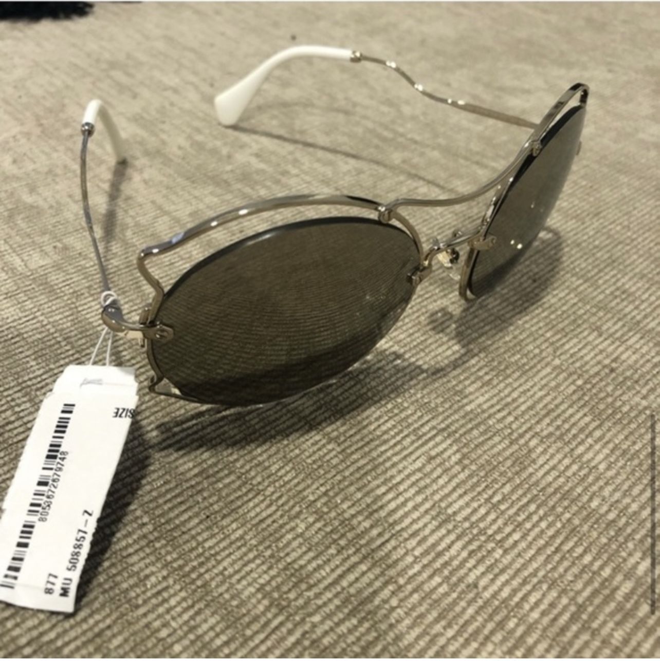 Miu Miu Women’s SMU50S Pale Gold Sunglasses 