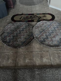 Two 3 Foot By 3 Foot Round Rugs and a Laundry Room Rug