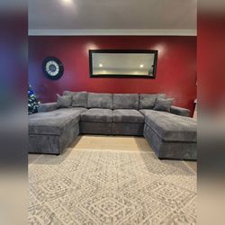 Gray corduroy sectional sofa with double chaise