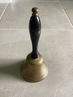 VINTAGE LG. BRASS SCHOOL  BELL-Iron ball-Wooden Handle 9 inches Tall and 4 inches wide at base Bell is Old used, early 1900’s to mid 20th Century. Thi