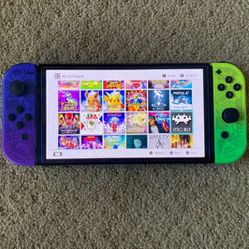 NINTENDO SWITCH OLED with Over 100 GAMES MARIO KART,POKEMON,ZELDA,MARIO PARTY and Many More