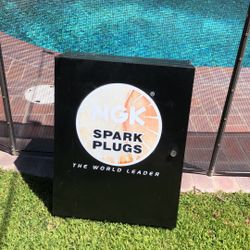 NGK Spark Plug Metal cabinet with Shelves 24” Tall by 18” wide by 8” Deep.