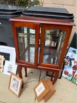 Decorative tables and china hutch .