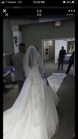 Selling my wedding dress asking $1,000 the value of this dress is 2 thousand and 100 hundred