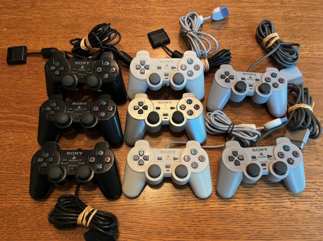 REAL Sony PS2 controllers with dual analog sticks playstation Genuine controllers in good condition.