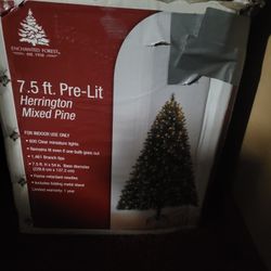 7.5 foot tall pre-lit Christmas Tree and a box of miscellaneous ornaments