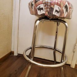 COUNTRY SWIVEL STOOL (HAS SMALL SLIT IN SEAT)  27 1/2" X 19" WIDE.   SEAT IS 14 1/2" WIDE