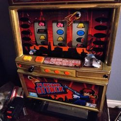 likely a Japanese Pachislo machine used for home entertainment. 
Type: Pachislo (Japanese skill stop) slot machine.
Theme: Space/Sci-fi with a charact
