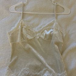 Beige velvet camisole and crocheted halter top with sun designs