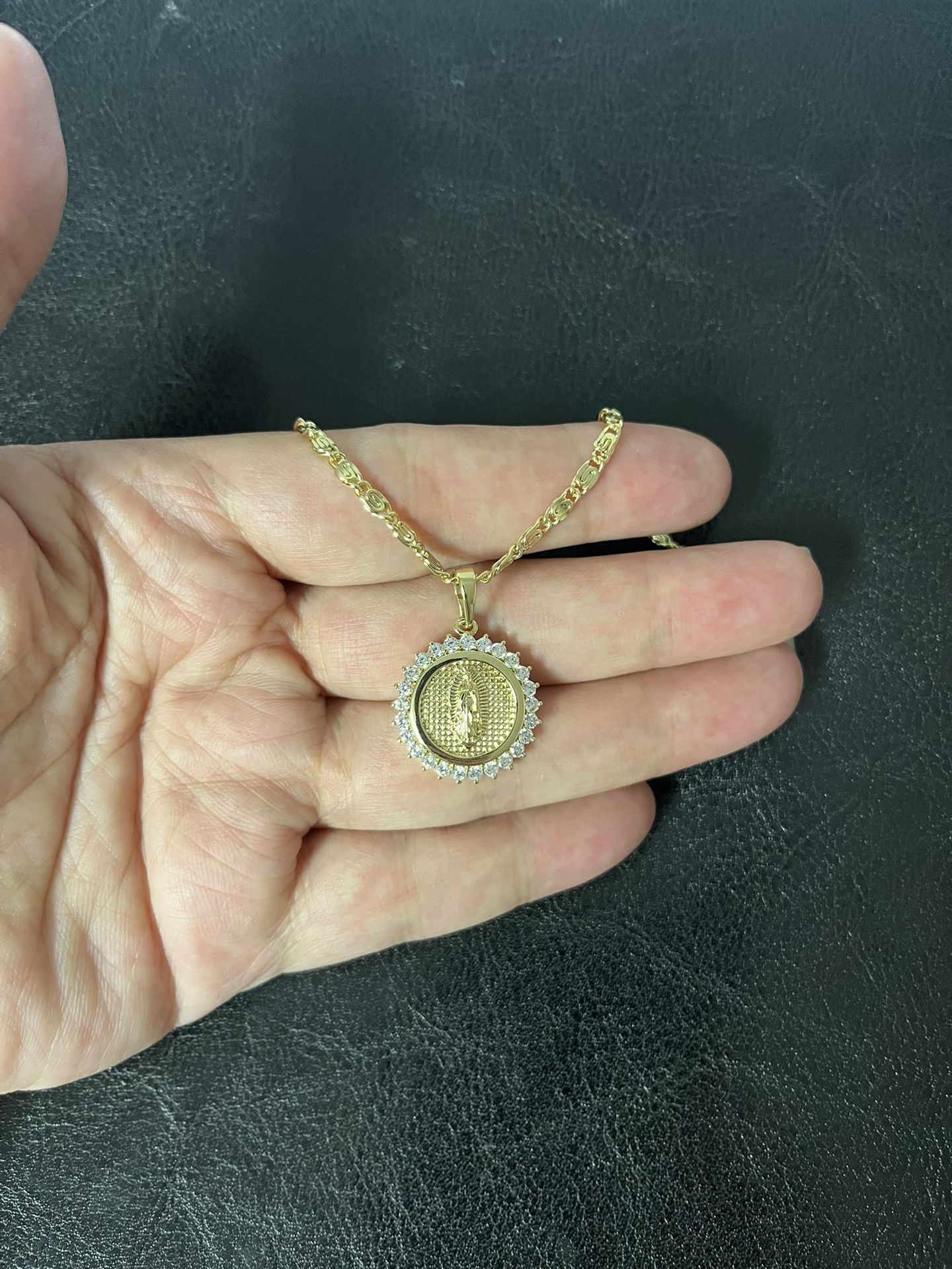Gold plated Guadeloupe pendant with chain.