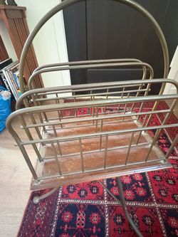 Antique swiveling magazine holder