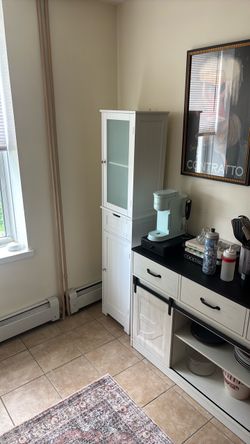Tall white kitchen or bathroom cabinet