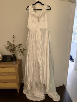 simple satin A-line wedding dress with a deep V neckline