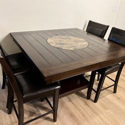 Counter high dining table with 4 chairs and lazy Susan
